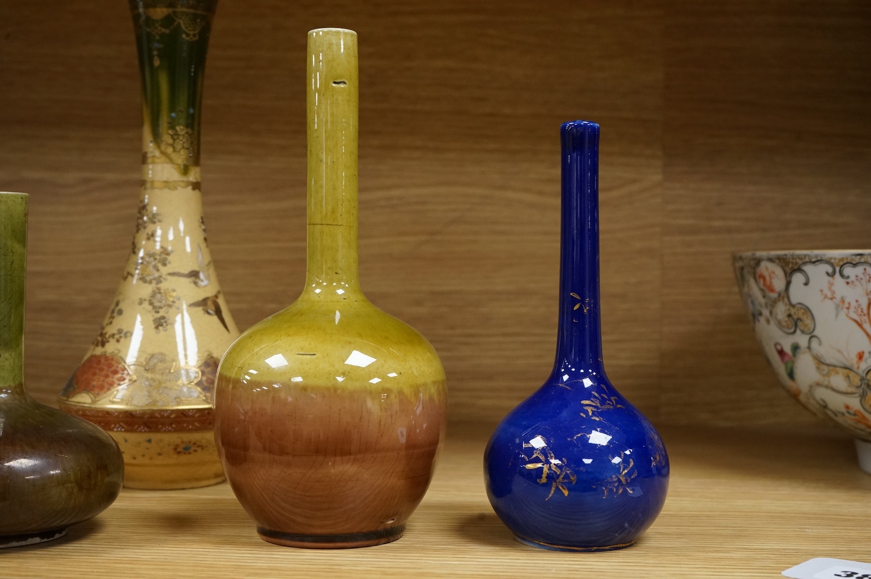 Three Japanese bottle neck vases and a Satsuma example, signed to the base, largest 25cm high